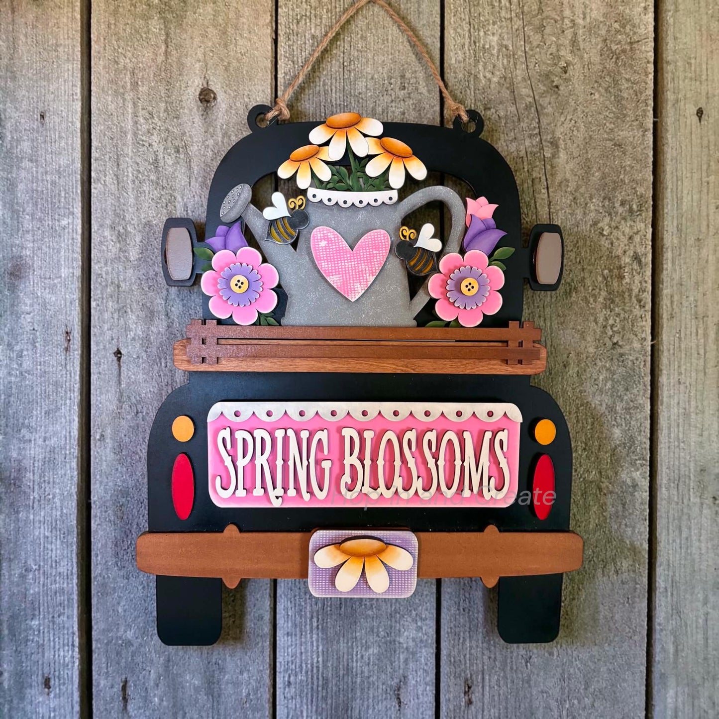 Interchangeable spring hanging truck insert