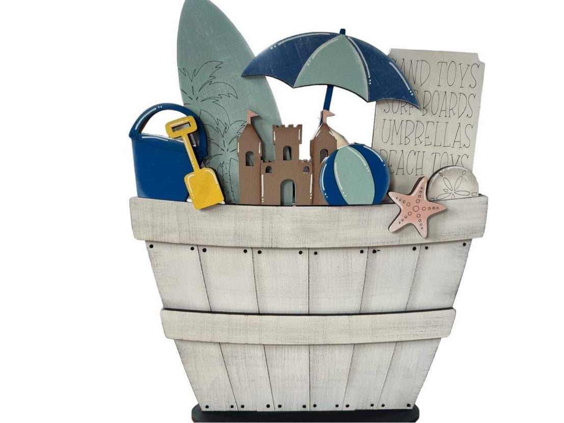 beach basket with surf board and sand castle