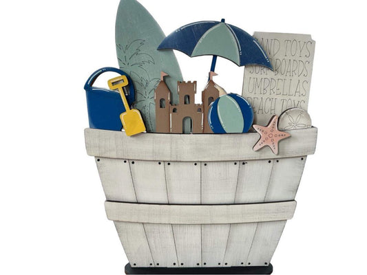 beach basket with surf board and sand castle