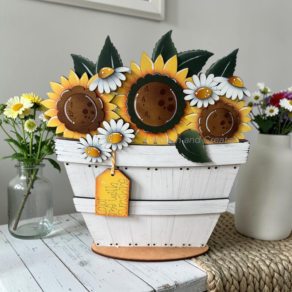 sunflower and daisies in a white basket